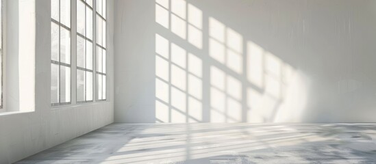 Wall Mural - White studio background designed for product presentation, set in an empty gray room with window shadows and a blurred backdrop for showcasing products.