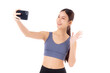 Portrait young asian woman in sportswear workout and selfie on smartphone isolated white background, girl in sportswear taking a photo on smart phone, sport and health care.