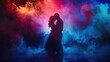 A couple is slow dancing in a colorful smoke filled room