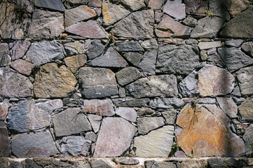 Wall Mural - Stone wall texture background - grey stone with different sized stones 2