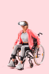 Poster - Sporty young woman in wheelchair with VR glasses on pink background