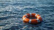 A life ring floating on the ocean, representing an emergency survival tool for ship crew members in need of help. Web banner with empty space