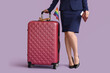 Young stewardess with LGBT flag and suitcase on lilac background