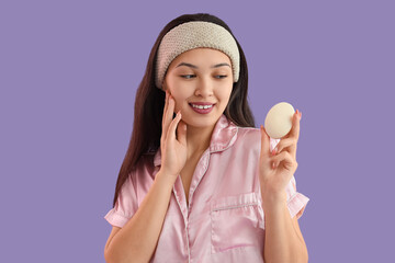 Canvas Print - Young Asian woman with soap on lilac background, closeup