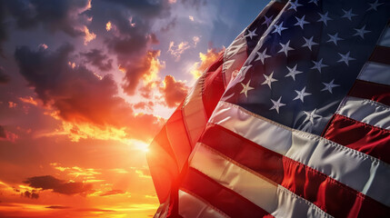 American flag silhouette against sunset sky