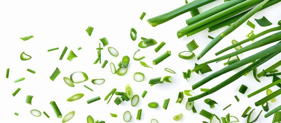 Sticker - Green onion slices and freshly cut chives are falling on a white background, isolated with clipping path.