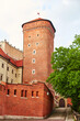 The old red brick Zamek Krolewski na Wawelu castle in the center of Krakow.