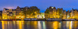 Amsterdam Netherlands, night panorama city skyline at canal waterfront