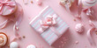 A pink gift box with a pink ribbon on it and flowers on the background.
