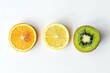 Highresolution image of a sliced juicy orange, kiwi, and lemon artistically placed on a pure white surface, ideal for clean and minimalistic designs