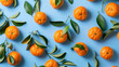 Many sweet mandarins on blue background