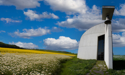 Serene countryside landscape featuring modern church