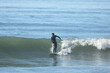 Surfer catches a wave at Solimar Beach, in Ventura, California.