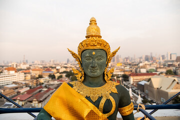 golden buddha statue on temple mount in bangkok thailand