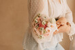 Girl holding white and pink blossoms bouquet
