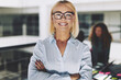 © Flamingo Images - Smiling young businesswoman at work