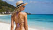 Young pretty blonde woman wearing  bikini, slim body, enjoy vacation and having fun on the beach, long  hairs