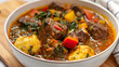 Aromatic jamaican curry goat stew with potatoes, carrots, and spinach served in a white bowl, showcasing caribbean cuisine flavors