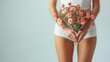 Healthy Legs. Women health and intimate hygiene. Beautiful Woman's body with smooth soft skin with flowers. Long woman legs on white with flowers. Skincare. Depilation. Epilation. Female health Care.