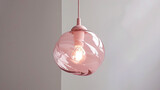 Fototapeta  - Hand-blown pastel pink glass light for a child's room or nursery.