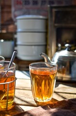 Thai hot tea on wooden blackground, retro style , morning light	