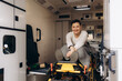 © Roman - Portrait of a happy woman in the middle of an ambulance