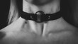 A young blonde with a choker and abrasions on her neck. Traces of violence. BDSM concept. Dramatic photo. Horizontal Wide Banner. Black and white