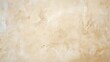 © tohceenilas - A close up of a beige wall with a rough texture.