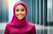Portrait of a young, beautiful and confident Islamic Muslim Arabic business woman wearing hijab with corporate buildings background.