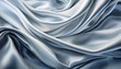 Blue silver colored wavy satin fabric textured background.