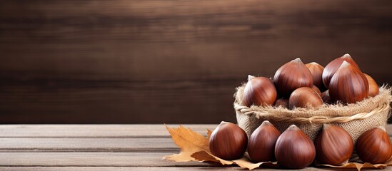 Poster - A copy space image showcases fresh sweet chestnuts on an old wooden table alongside a basket perfect for Christmas