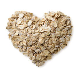 Wall Mural - Heart shaped oat flakes on a white background. Top view