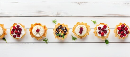 Aufkleber - A festive assortment of phyllo pastry appetizers featuring cranberries and baked brie arranged on a white wood background The top view table scene offers a captivating copy space image