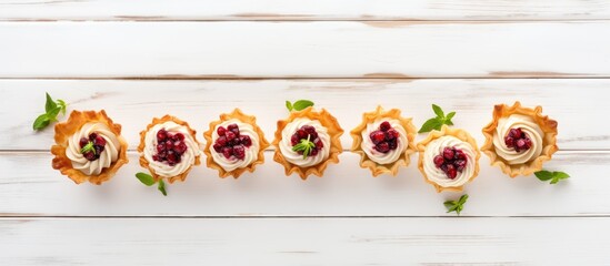 Aufkleber - A festive assortment of phyllo pastry appetizers featuring cranberries and baked brie arranged on a white wood background The top view table scene offers a captivating copy space image