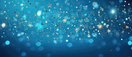 Fototapete - A festive blue background with sparkling confetti stars and bokeh lights creating a vibrant holiday atmosphere The flat lay perspective captured from above offers a copy space for various occasions s