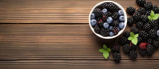 Poster - A breakfast bowl of yogurt oatmeal blueberries blackberries and chia seeds is beautifully displayed on a rustic wooden surface in a top down view leaving ample room for text or a caption in the copy
