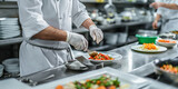 Fototapeta  - A image of a chef working in a busy commercial kitchen, preparing gourmet dishes and coordinating with kitchen staff