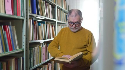 Wall Mural - Bookish Delight A Senior Man Engrossed in Reading