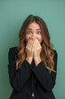 © Fabio - pretty woman looking happy, cheerful, lucky and surprised covering mouth with both hands. business concept