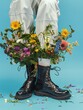 © Vladimir - A bouquet of flowers is inserted into white socks and black boots. Legs of a model on a blue background. Photography in fashion editorial style.