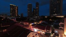 Singapore - April 2024, : Timelapse Rooftop View Illuminated Buildings People Walking On Pedestrian Street At The Famous Kampong Glam Neighborhood, Aka Muslim Quarter