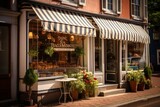 Fototapeta Londyn - A Charming Small Town Bakery with a French-Style Striped Awning, Freshly Baked Goods Visible Through the Window