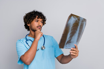 photo of thoughtful doctor guy hold x ray look thinking isolated grey color background