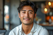 © Spicy World - Close up portrait of smiling Asian man in white shirt