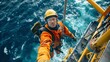 © PaulShlykov - Inspection engineer rappels down a rotor blade of offshore wind turbine