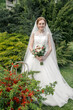 Bride with bouquet at garden