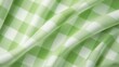 © tohceenilas - A green and white checkered picnic blanket with wrinkles. 3d rendering.  texture wallpaper.