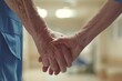 A tender moment captured as an elderly patient holds hands with their caregiver in a hospital setting, symbolizing trust and care.