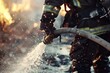 A detailed capture of a firefighter extinguishing a fierce fire using a water hose, with sparks and water droplets illuminated by the fire's glow.