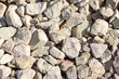 Industrial pavement top view, yellow rocks background texture